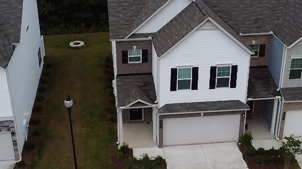 Aerial view of a home's roof and shingles during an inspection