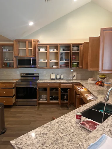 Kitchen cabinets and drawers opened for inspection