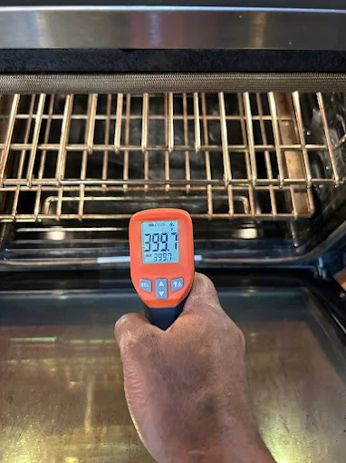 Infrared thermometer used to verify oven temperature