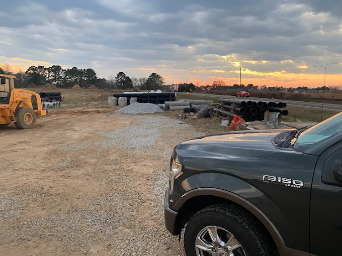 Inspection truck at a new construction site at sunrise